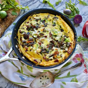 Brussels Sprouts Frittata with Arugula, Purple Potatoes, Manchego