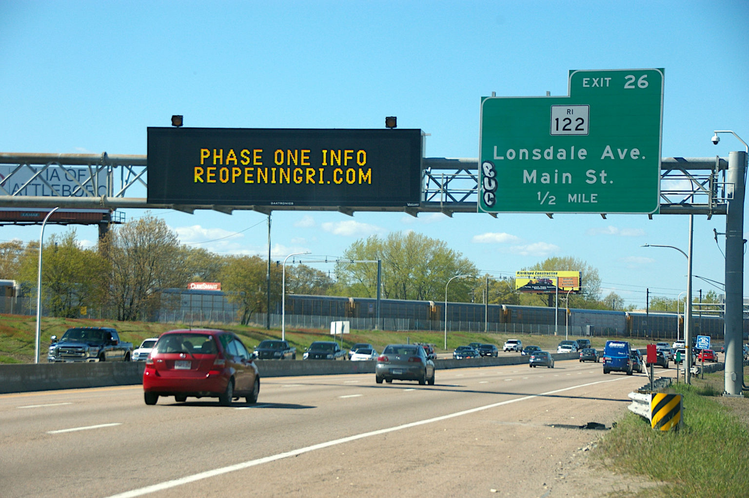 “Phase One info ReopeningRI.com” highway sign, I-95 northbound;