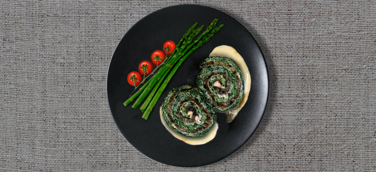 Spinach roulade with mushrooms, cheese and Dijon mustard sauce