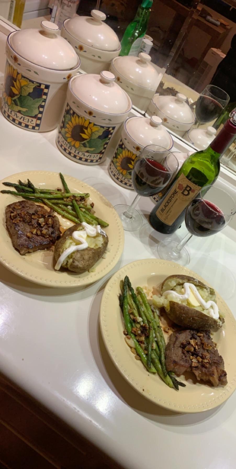 Boyfriend and I made medium rare ribeyes, garlic asparagus, and jacket baked potatoes, first time trying to make baked potatoes!