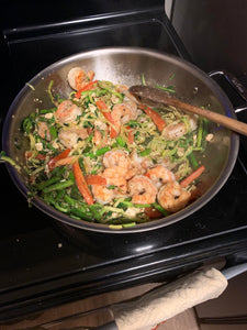 Shrimp, zucchini noodles, asparagus and bell peppers with feta. One of my favorite quick weekday meals